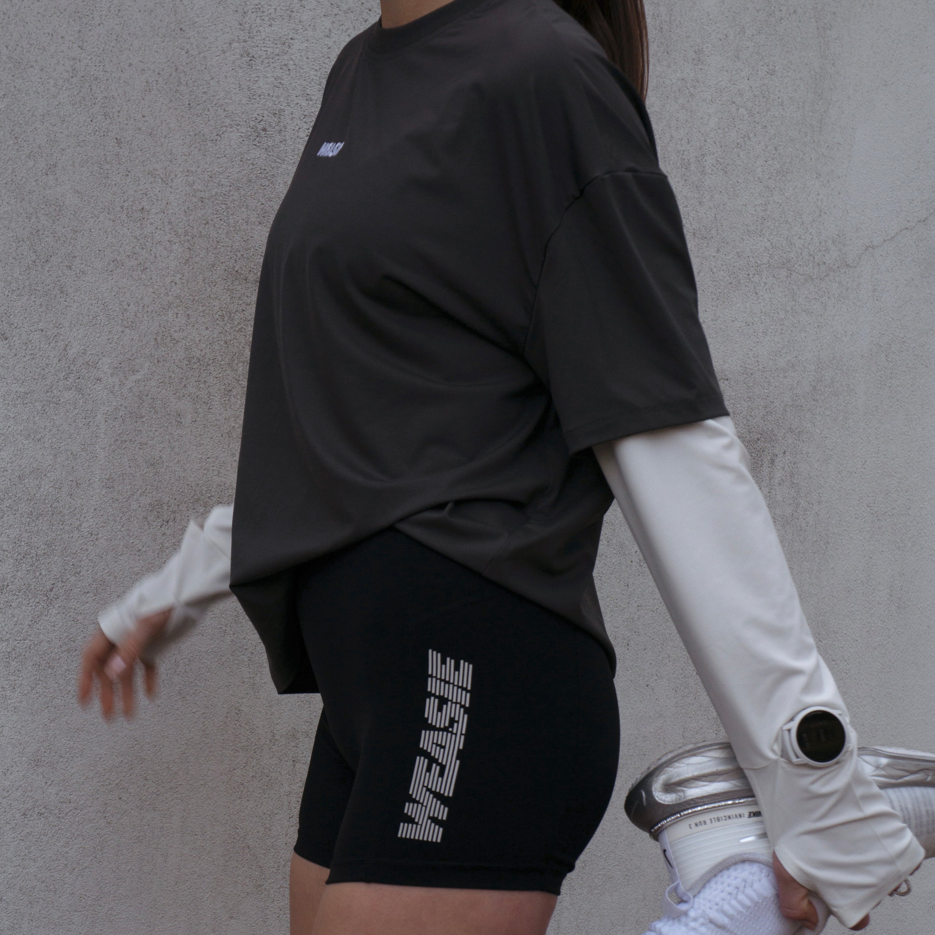 Side view of women's grey running 2-in-1 long sleeve top, layered look – WEASIE